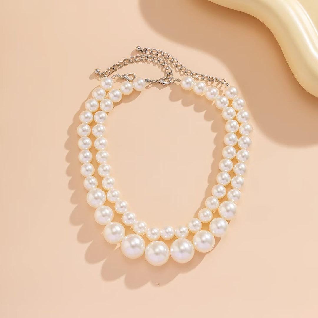 Women's timeless double strand synthetic pearl necklace, perfect elegant jewelry for special occasions.
