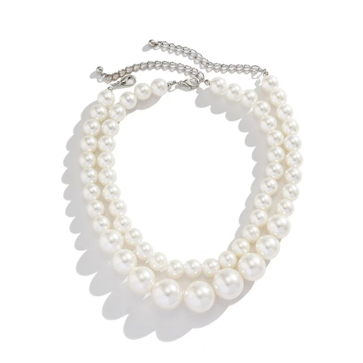 Beautiful women's double strand synthetic pearl necklace, adding a touch of timeless elegance to any outfit.