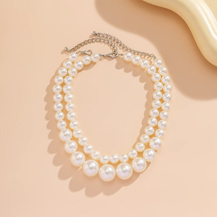 Two-strand synthetic pearl necklace for women, a chic and elegant jewelry piece for any special occasion.