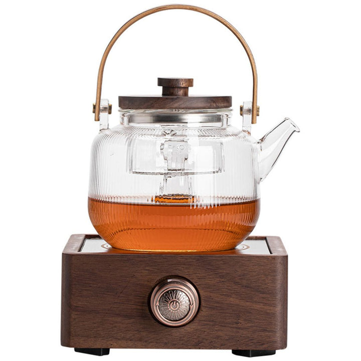 Elegant electric tea warmer with walnut base & adjustable temperature. Perfect for hot beverages at home.
