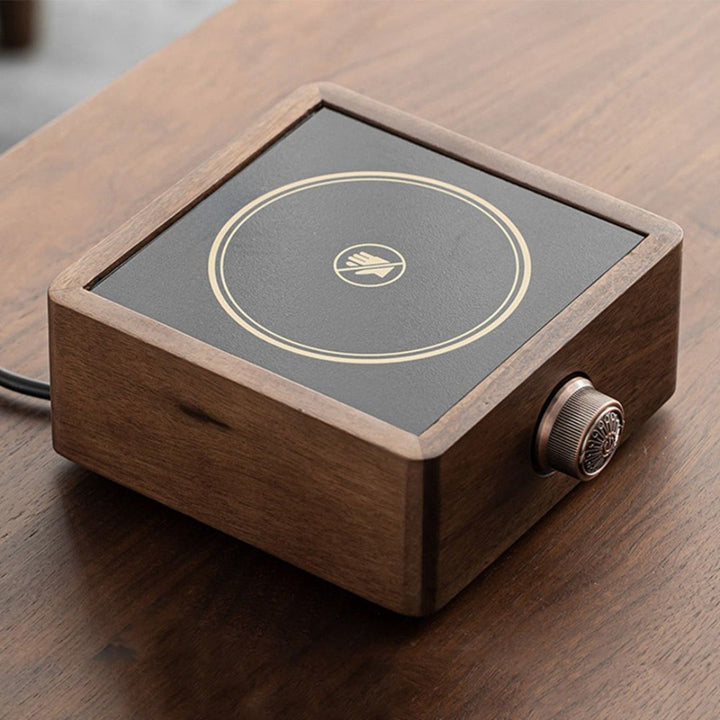 Stylish home electric tea warmer featuring a rich walnut wood base, ideal for modern kitchen decor.