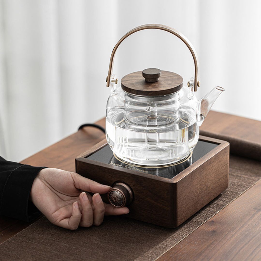 Modern electric tea warmer with a beautiful walnut base and precise adjustable temperature settings.