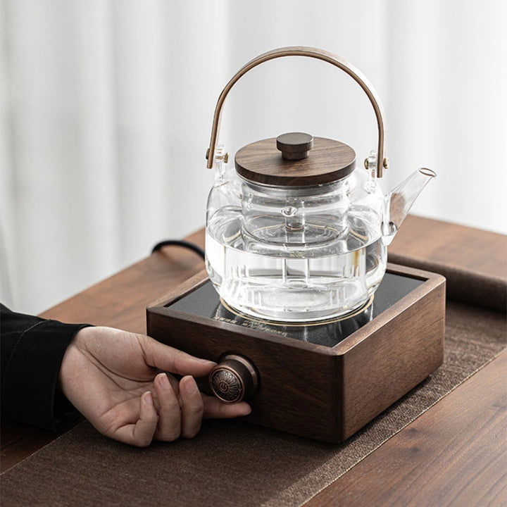 Modern electric tea warmer with a beautiful walnut base and precise adjustable temperature settings.