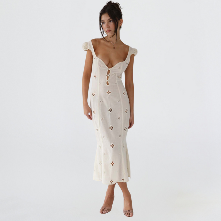 Women's elegant embroidered mermaid wedding dress with stylish puff sleeves.