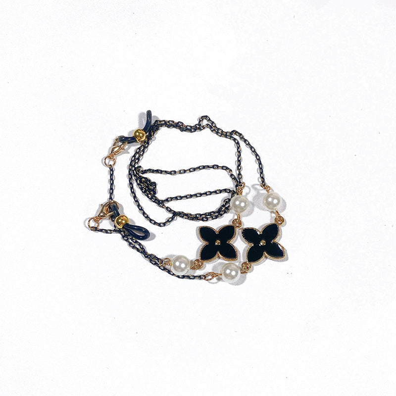 Exquisite women's accessory: an elegant filigree jewelry band with subtle pearl details.