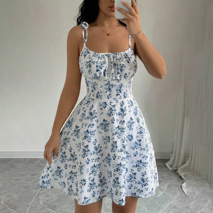 Women's feminine floral A-line summer dress. Elegant spring fashion, casual midi dress, vacation ready.
