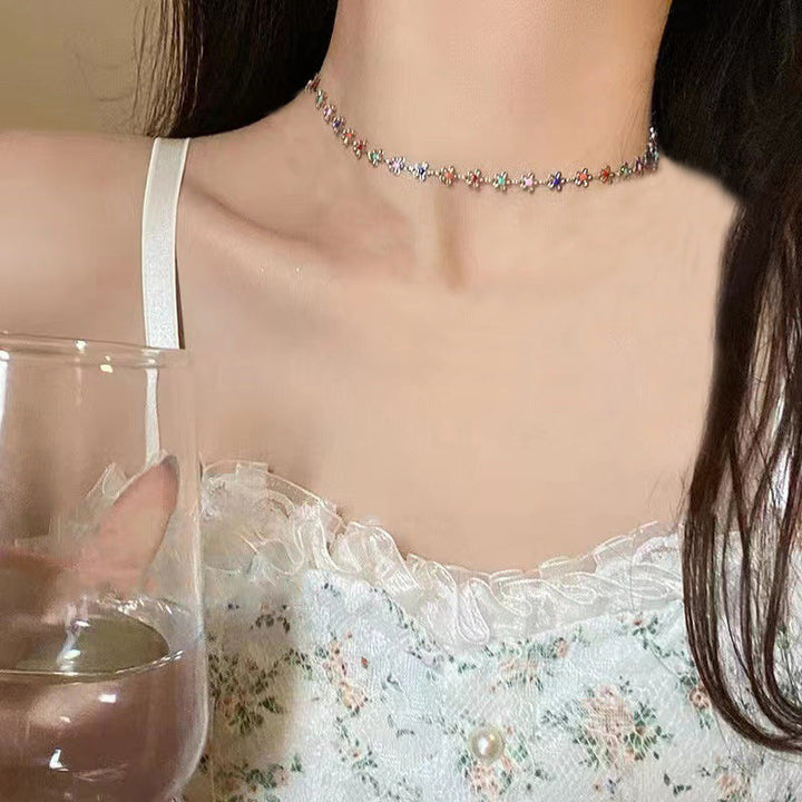 Delicate women's floral charm choker necklace, adjustable flower jewelry for an elegant look.