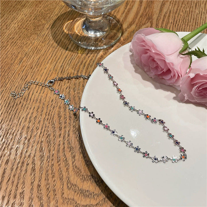 Beautiful women's floral choker with charm, an adjustable and elegant flower necklace.