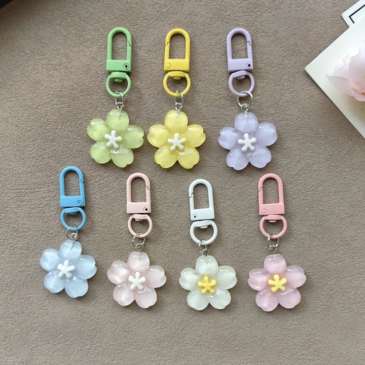 Stylish metal flower keychain with colorful petals, perfect elegant bag charm accessory.
