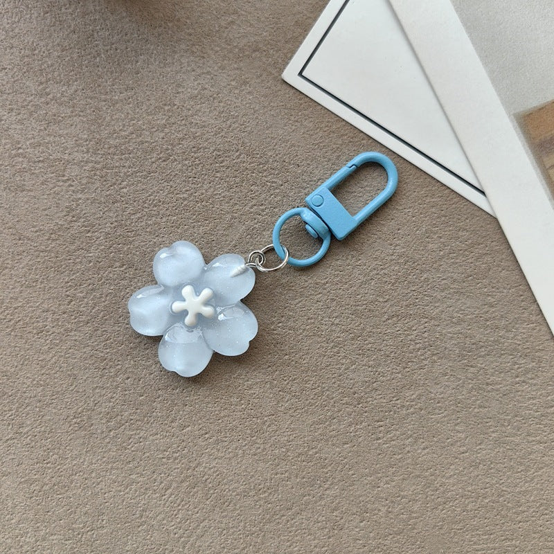 Versatile floral key holder & bag accessory, an elegant women's flower keychain.