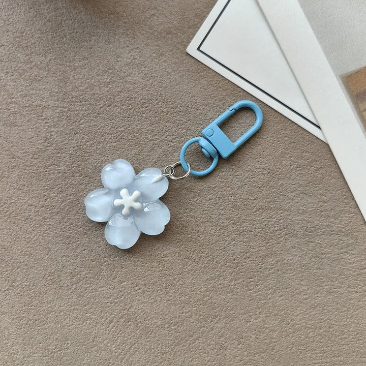Versatile floral key holder & bag accessory, an elegant women's flower keychain.
