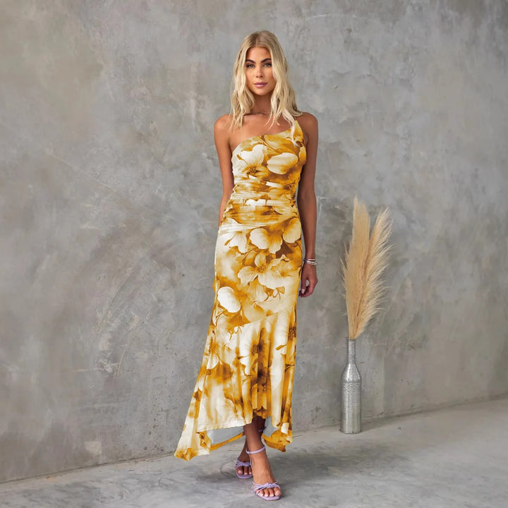 Women's colorful floral midi dress, elegant one-shoulder ruched style, flowy for warm weather.