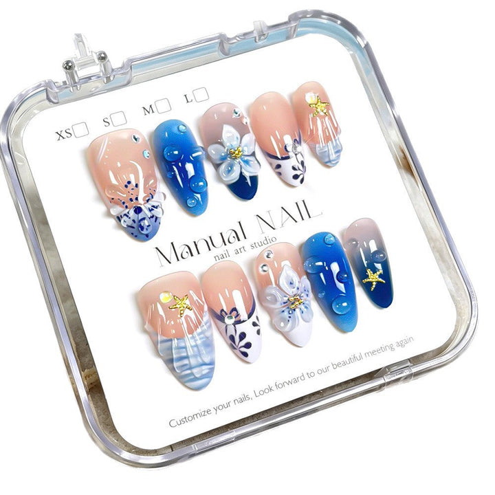Artistic floral press-on nail set for women. Detailed fake nails for a stylish, elegant manicure & beauty statement.
