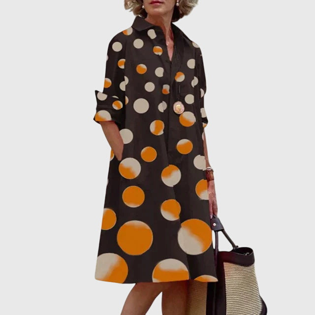 Elegant women's dress featuring handy pockets. Flowy & comfortable for chic casual spring and summer style.