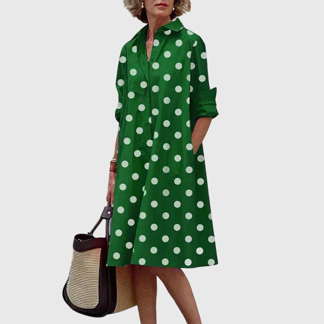 Back view of a flowy, elegant women's dress. Comfortable & chic design with pockets, great for summer fashion.