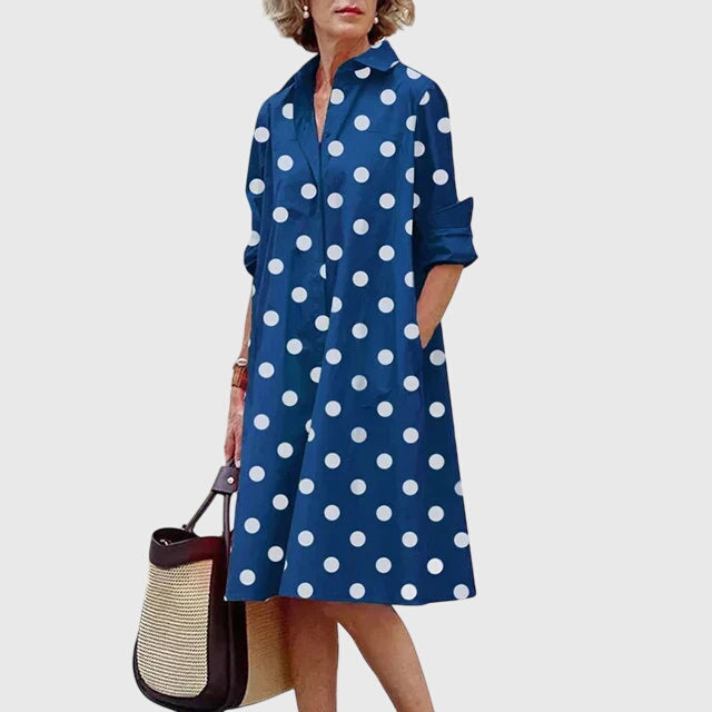 Side view of a woman in a chic, flowy elegant women's dress with pockets. Perfect for spring casual comfort.