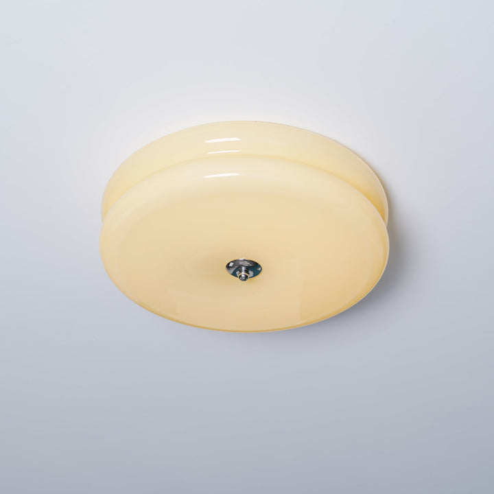 Elegant fluted glass LED ceiling light for a stylish bedroom.