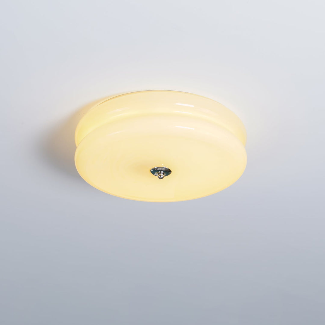 Dimmable fluted glass LED ceiling light, providing adjustable brightness.
