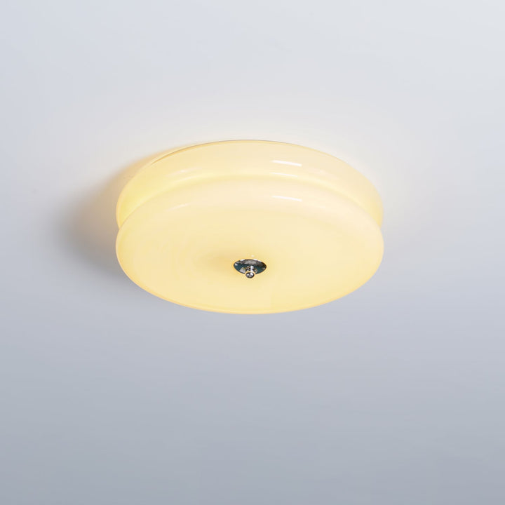 Dimmable fluted glass LED ceiling light, providing adjustable brightness.