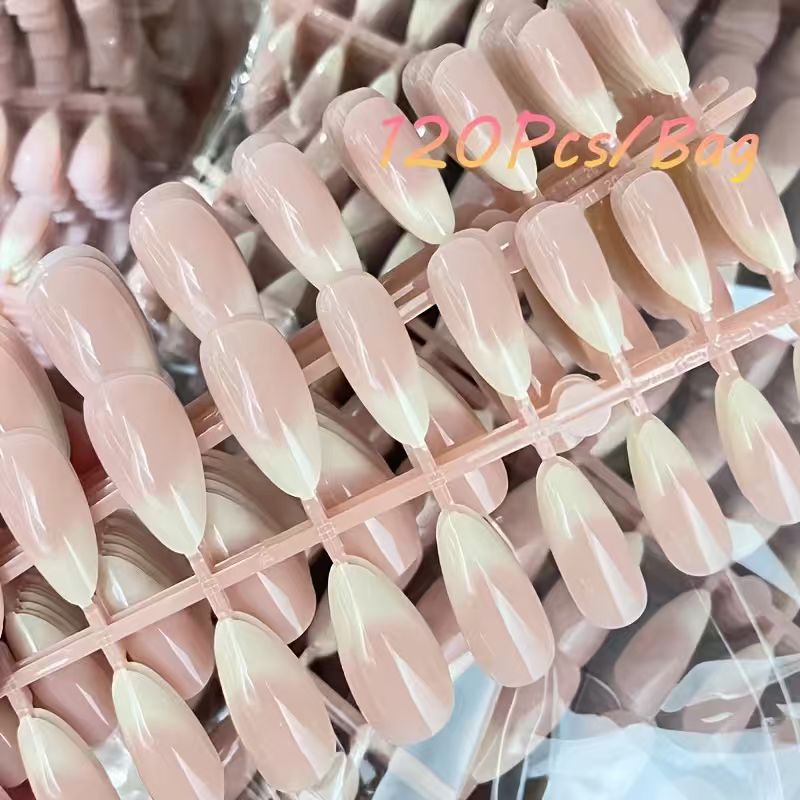 Elegant French tip press-on acrylic nails for women, perfect for a quick, salon-quality nude manicure. Easy false nails.