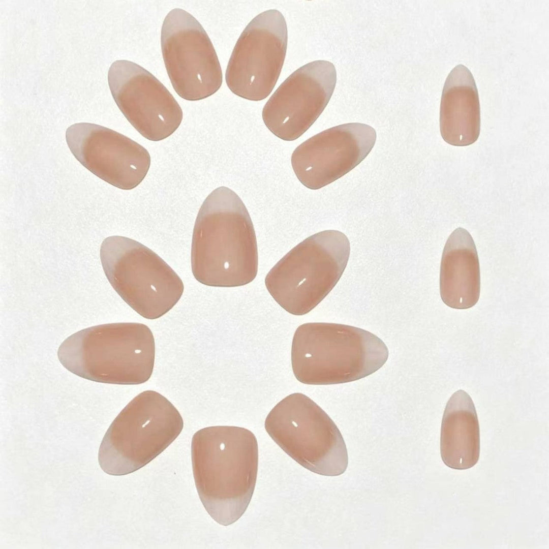 Women's French tip nail art kit: salon-quality press-on nails for elegant, beautiful hands. Easy DIY at-home manicure.