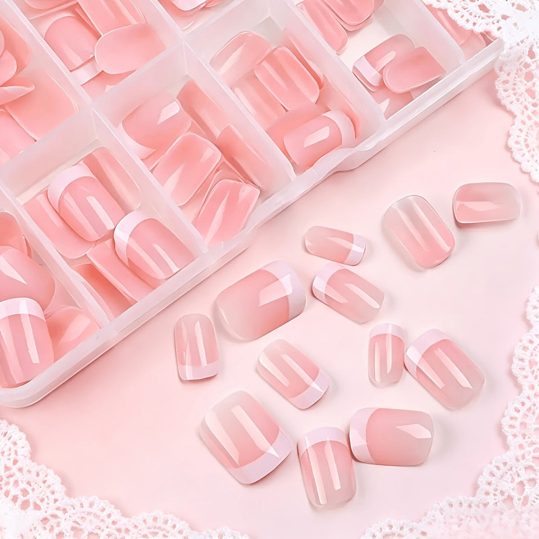 Classic white French tip press-on nails for a chic & easy at-home manicure. Durable, reusable false nail art.