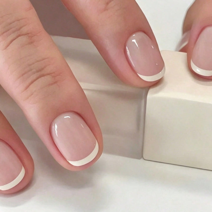Stylish French tip press-on nails, ideal for a quick & elegant nail art transformation. Complete false nail kit.