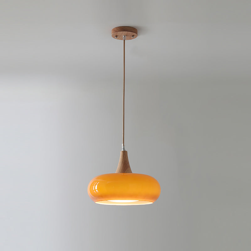 Contemporary glass and wood pendant lamp, perfect for dining room. Adjustable height ceiling light.