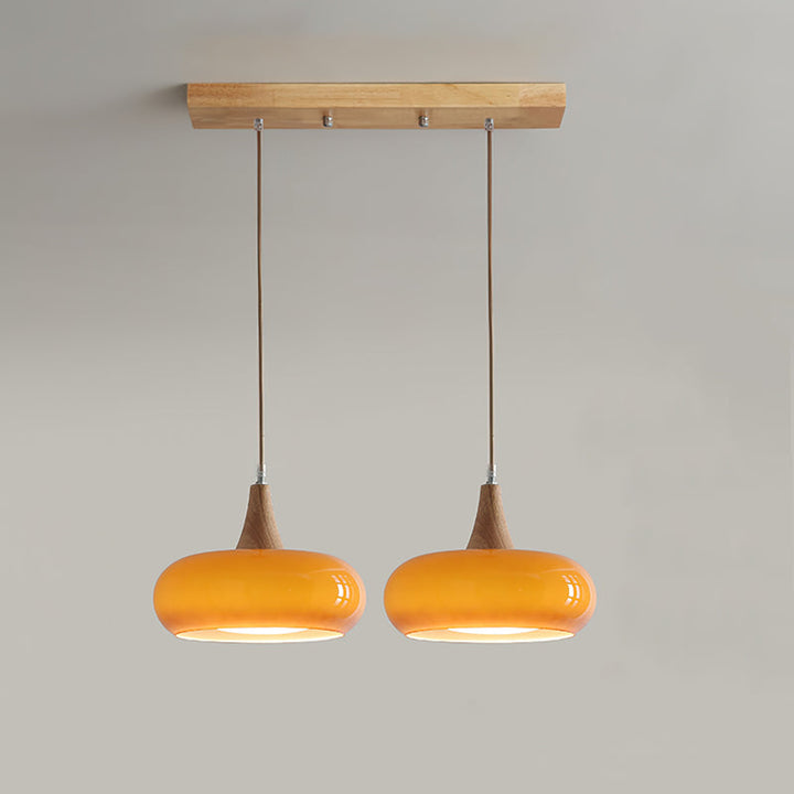 Elegant adjustable glass & wood pendant light, perfect for any modern living space.