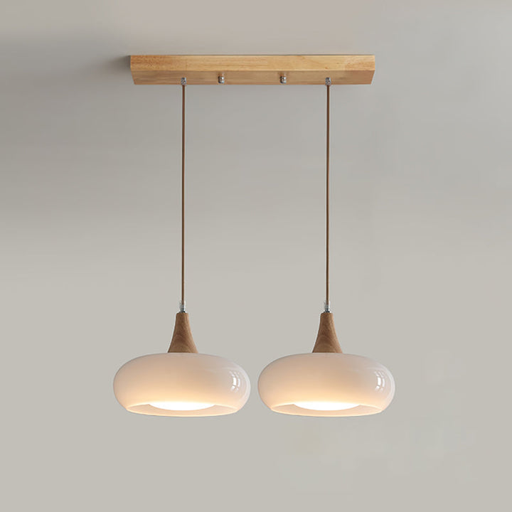 Decorative glass, wood, metal pendant light, enhancing modern interiors. Unique ceiling lamp.