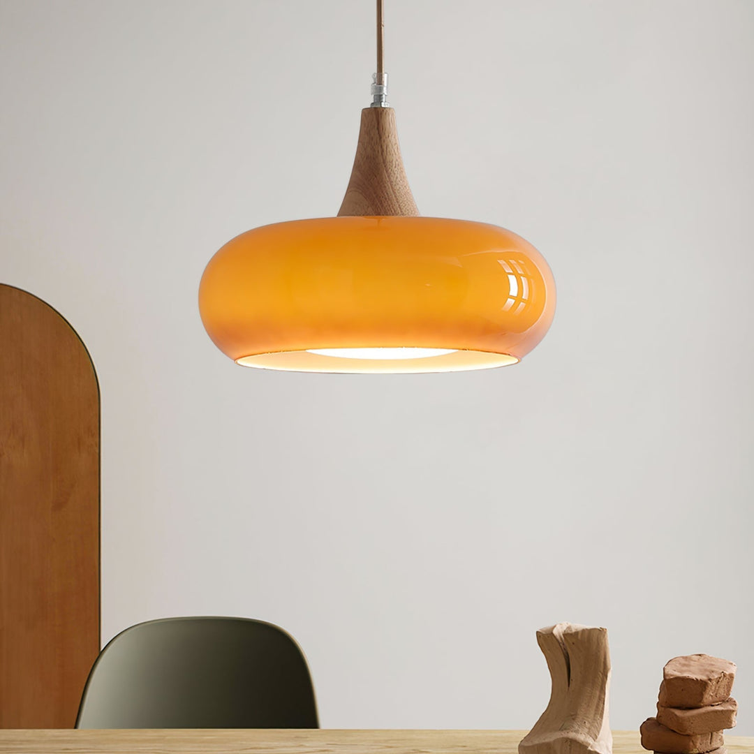Modern adjustable glass pendant lamp for kitchen or dining area. Elegant home decor lighting.