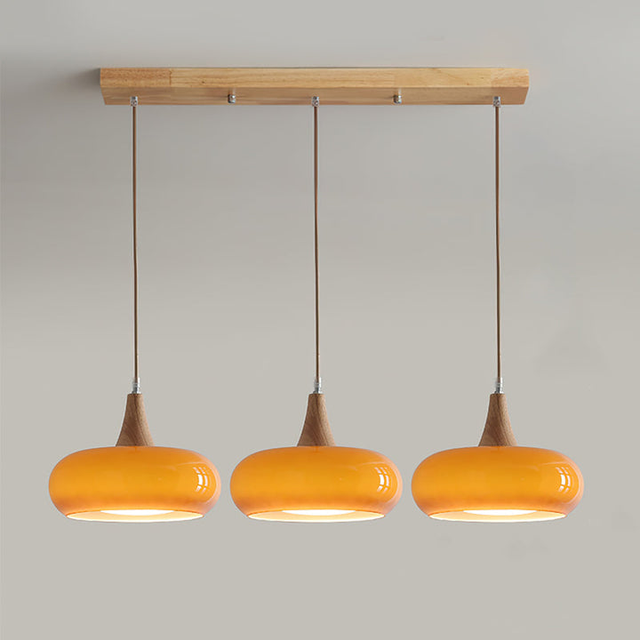 Modern lighting: wood & glass pendant lamp for a warm ambiance in living or dining spaces.