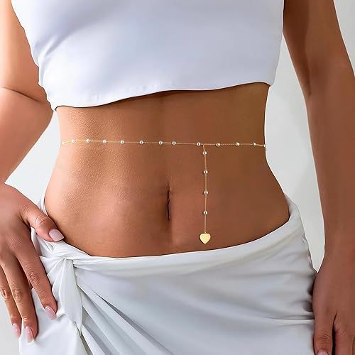 Stylish gold body chain for women, adorned with lustrous pearl & heart charms. Chic, adjustable waist accessory.