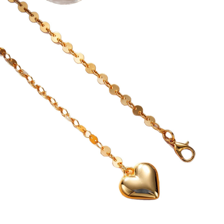 Stylish gold body chain for women, perfect for beachwear. Delicate summer accessory for a touch of elegance.