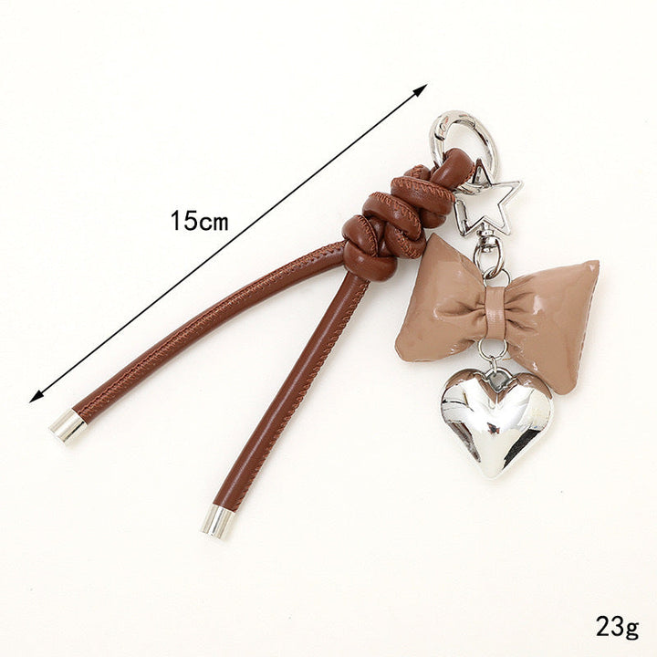 Shiny metal bow & heart key holder, a designer quality fashion accessory.