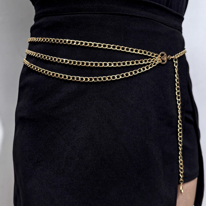 Women's adjustable gold chain belt, an elegant waist accessory to elevate dresses & skirts.