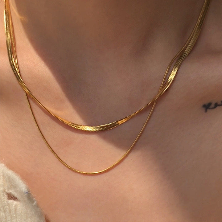 Chic layered snake chain necklace for women, featuring a beautiful double strand gold design.
