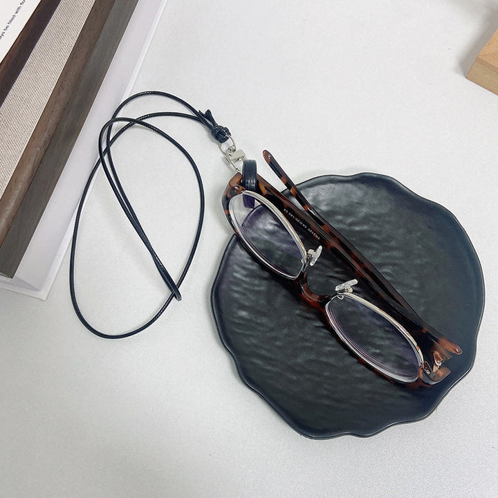Delicate beaded glasses chain in rose gold. Secure eyewear holder, a chic and practical fashion accessory.