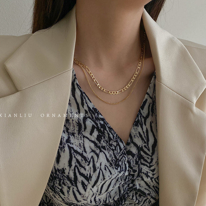 Elegant gold layered chain necklace for women, a stylish fashion jewelry accessory.