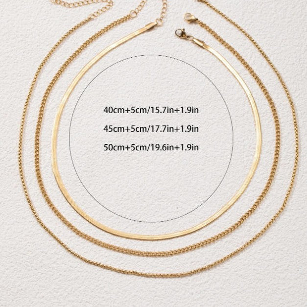 Delicate women's gold layered necklace. Features multiple dainty chains, perfect for an elegant fashion statement.