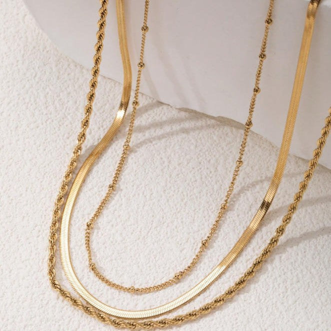 Stunning multi-layer gold chain necklace, an adjustable women's jewelry piece. Ideal as an elegant gift for her.
