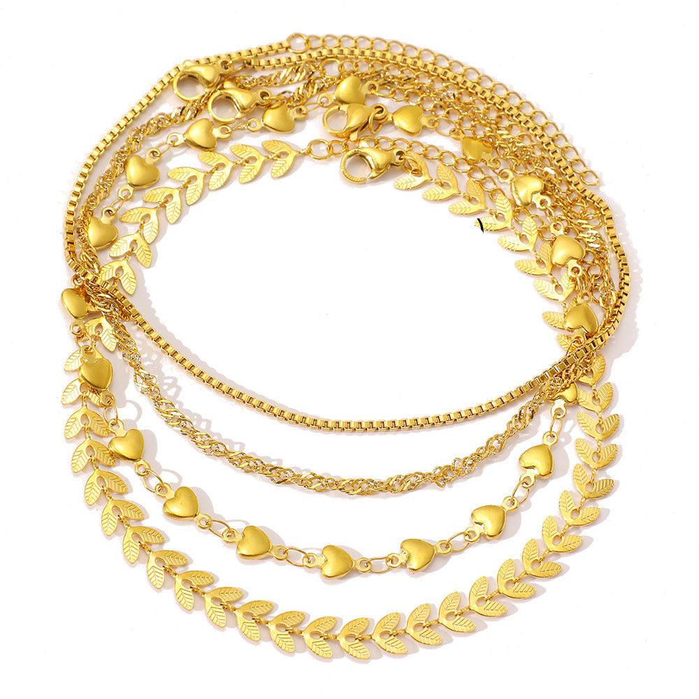 Close-up: Dainty gold layered necklace featuring elegant heart charms. Women's fashion accessory.