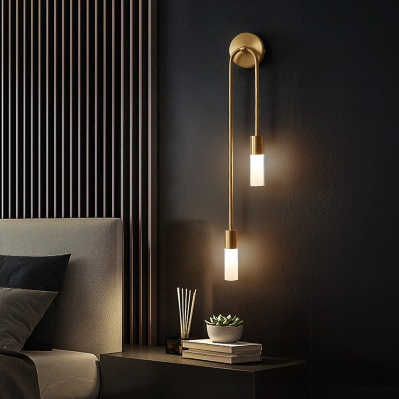 Decorative gold LED wall light fixture providing ambient indoor lighting, modern home accent.