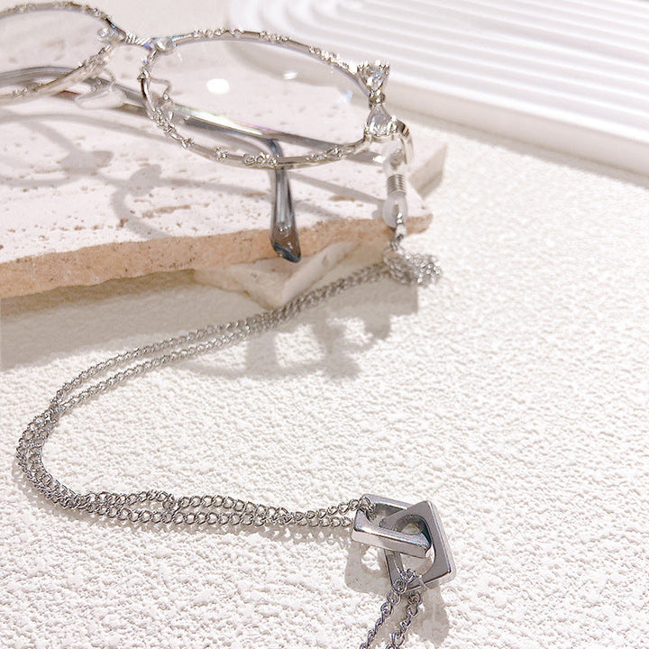 Close-up of a stylish gold link glasses chain, a durable and fashionable eyewear holder.