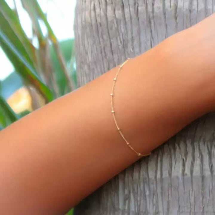 Elegant gold-plated women's bracelet, a delicate fashion accessory perfect for any occasion. Classic style jewelry gift.