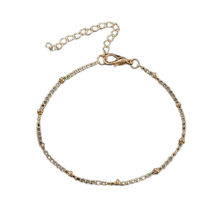 Women's elegant gold-plated bracelet, a delicate and classic fashion accessory for timeless style on any wrist.