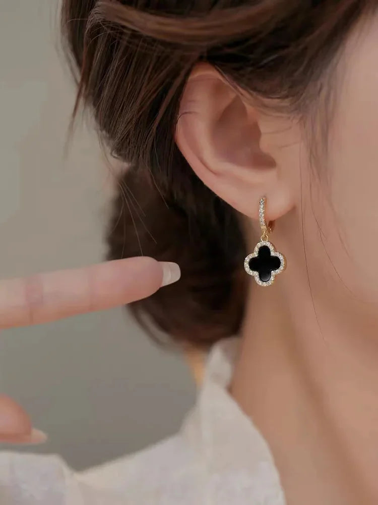 Close-up of a single Lucky Clover Leaf Earring, a sparkling crystal and gold-plated design for women.