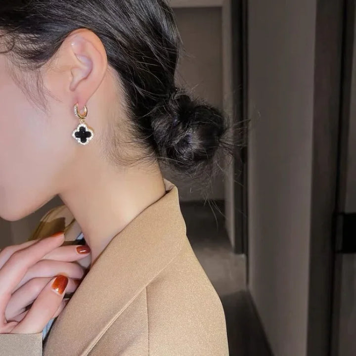 Lucky Clover Leaf Earrings for women, featuring a delicate gold-plated design and sparkling crystals.