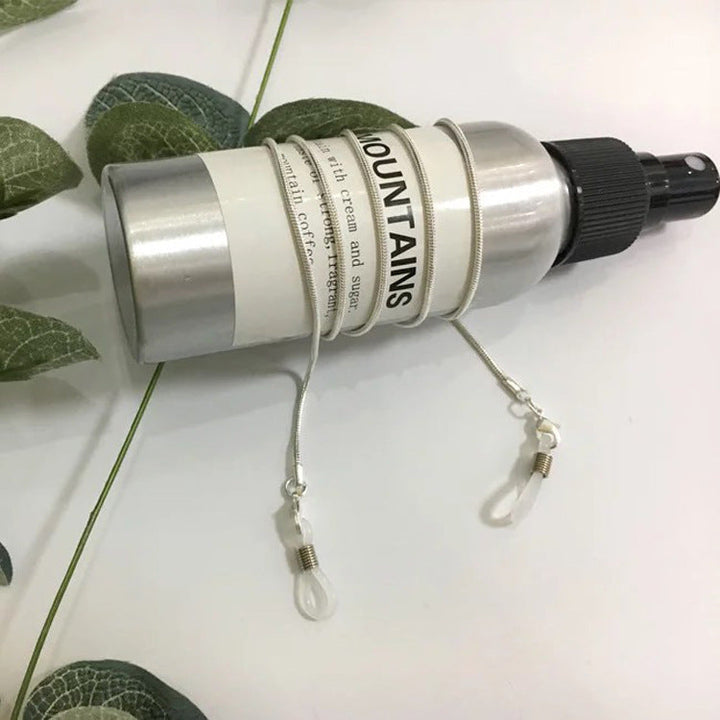 Elegant gold refillable spray bottle with hanging hook, perfect for home decor, kitchen, or bathroom.
