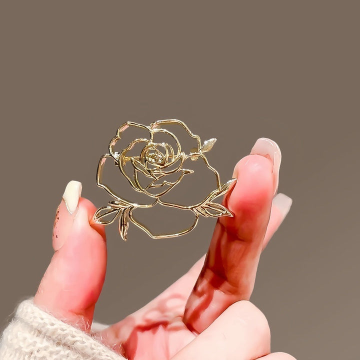 Beautiful silver rose flower lapel pin, perfect women's jewelry accessory.